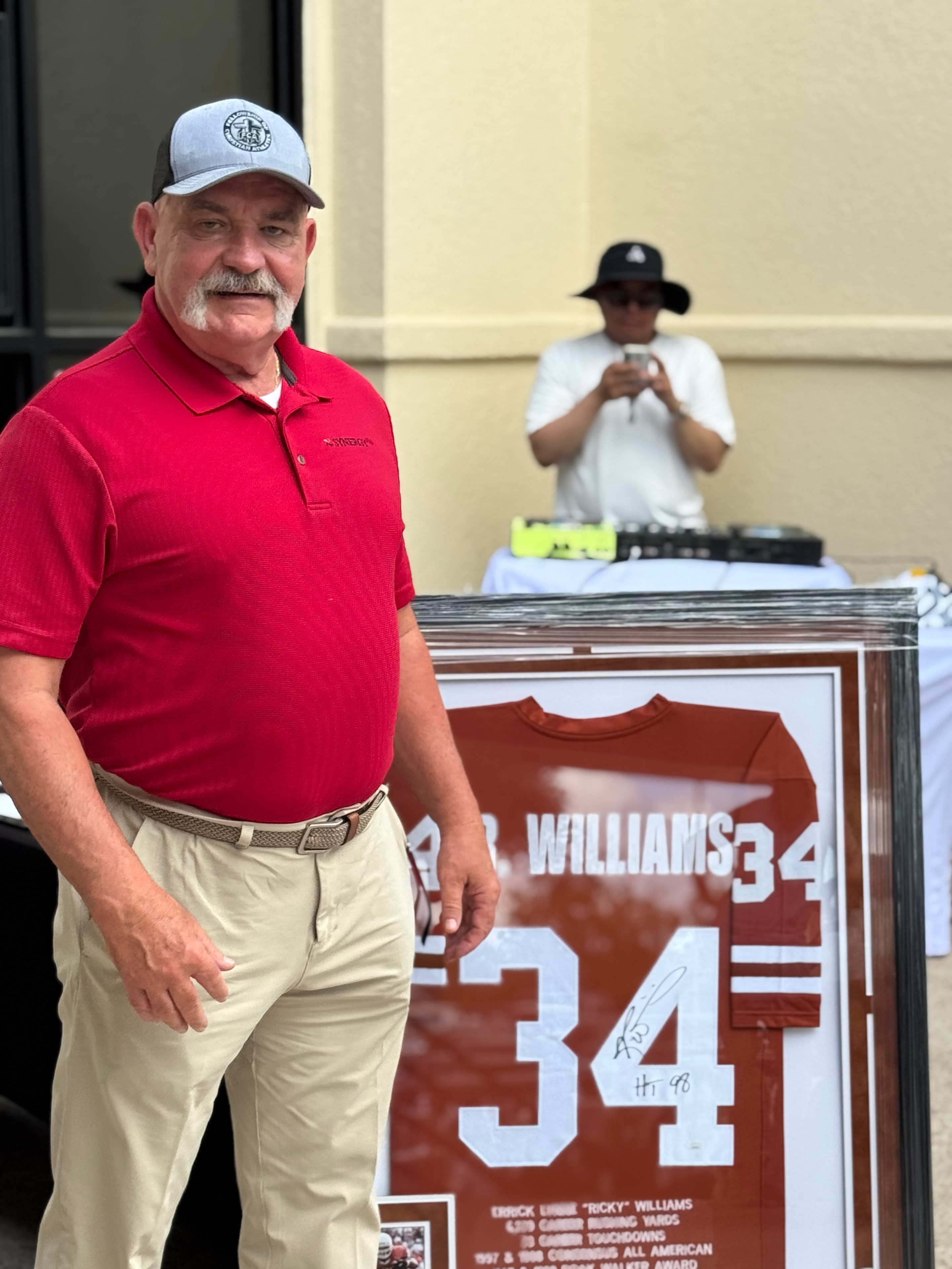 Coach V with Ricky Williams jersey